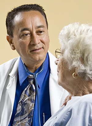 Healthcare provider talking to woman.